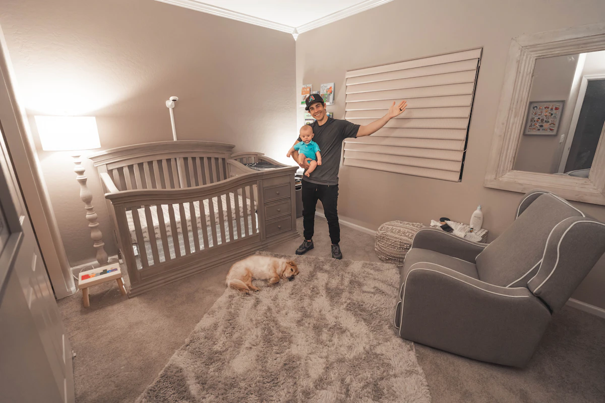 Nursery crib setup with a wall-mounted camera, the kind of setup the best baby monitor for twins needs to cover two cribs
