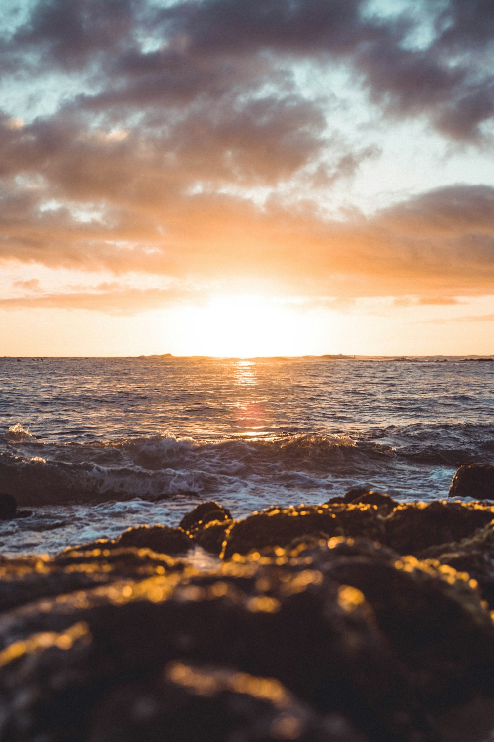 body of water during sunset