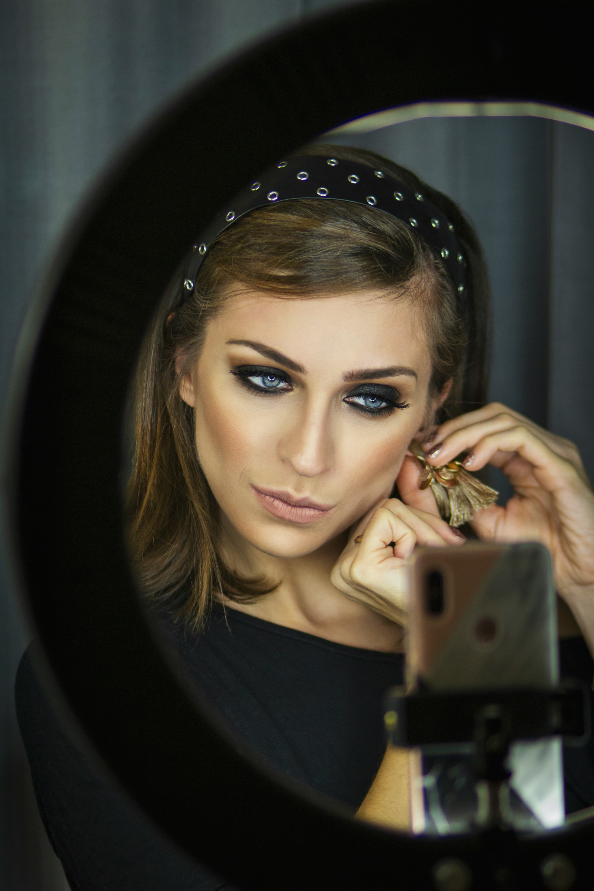 Woman in front of a ring light 