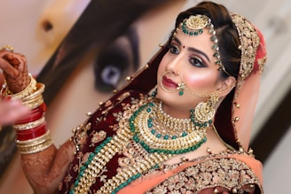 woman in red and gold sari