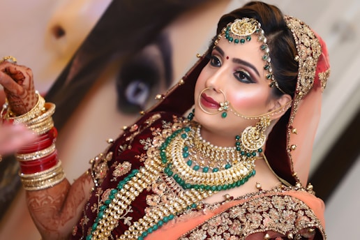 woman in red and gold sari