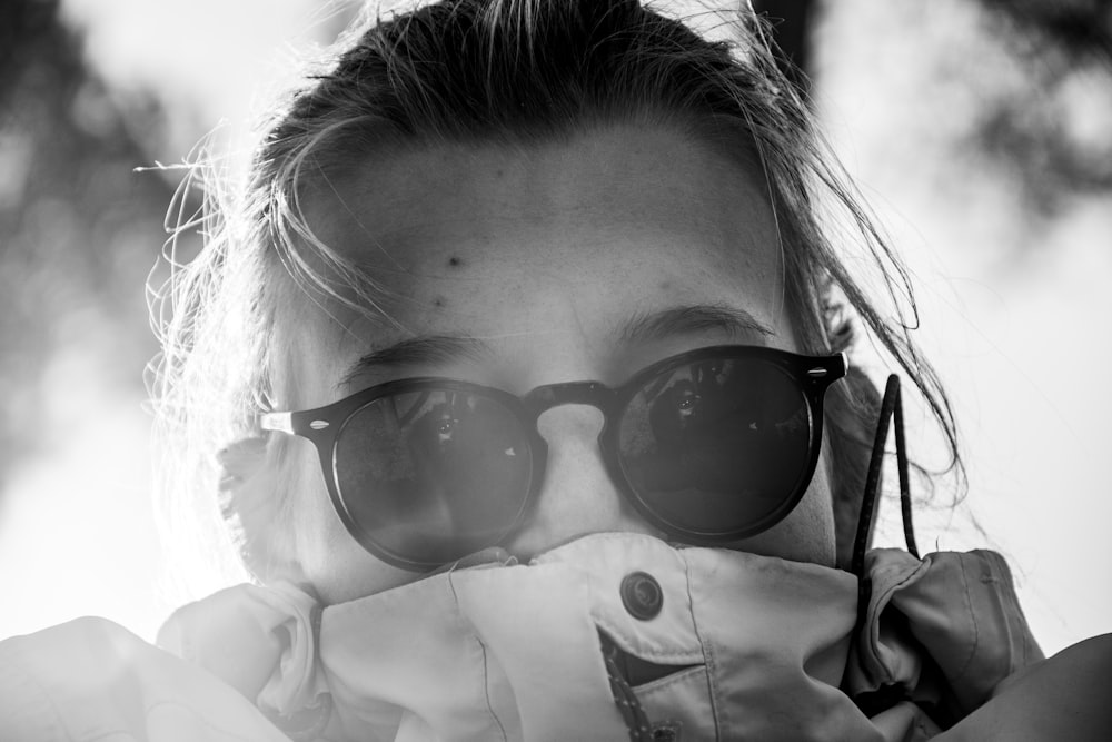 girl wearing black sunglasses in grayscale