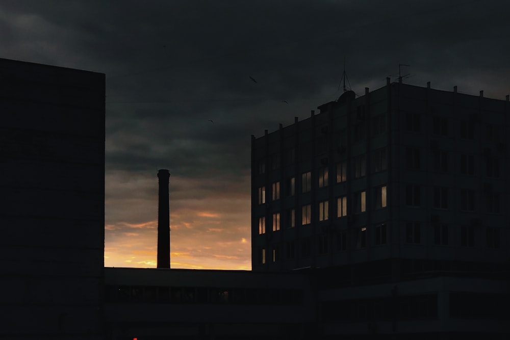 silhouette of building during night time