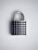 A silver padlock with a rectangular body and a curved shackle sits against a light background. The front of the padlock is adorned with rows of small, circular blue gems, giving it a decorative appearance.