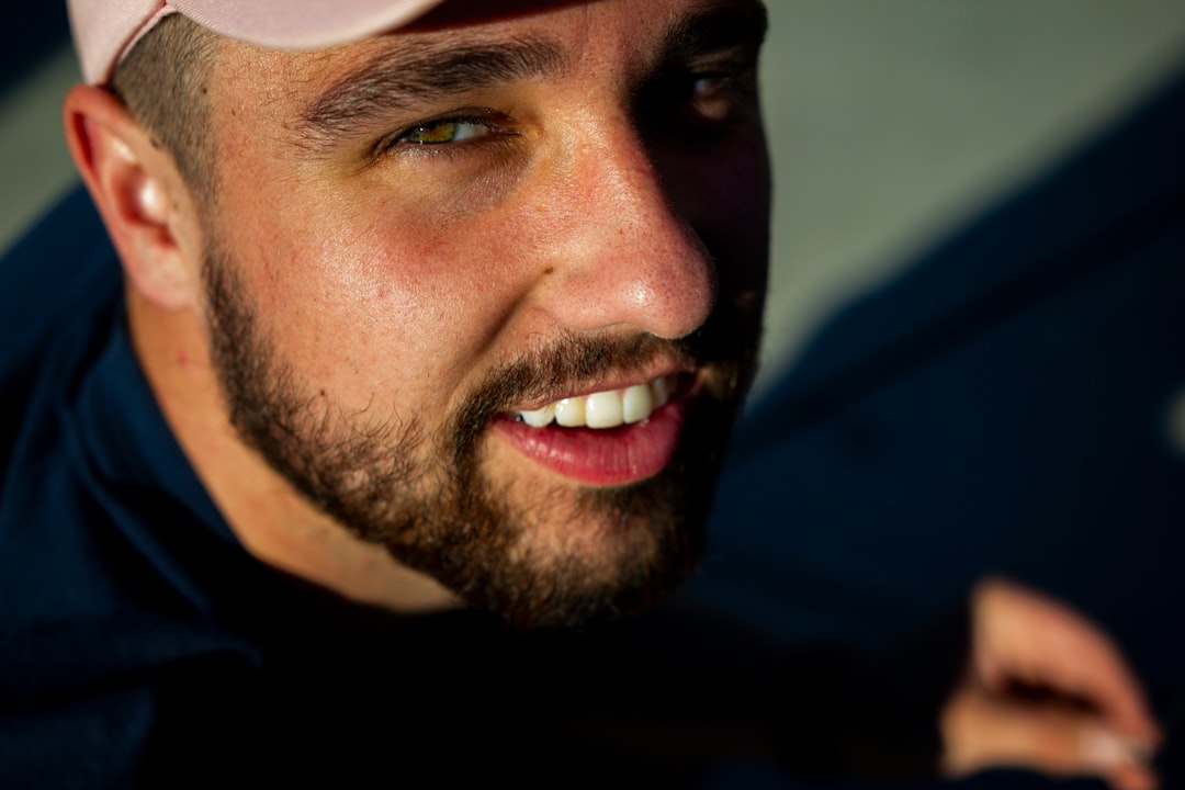 man in black shirt smiling