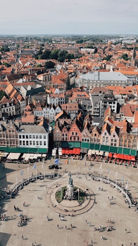 A scenic view of Enghien’s town square bustling with locals and visitors.