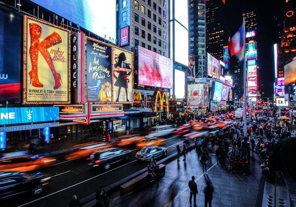 people walking on street during night time