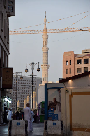 Modern infrastructure blending seamlessly with historic architecture in an Omani city.