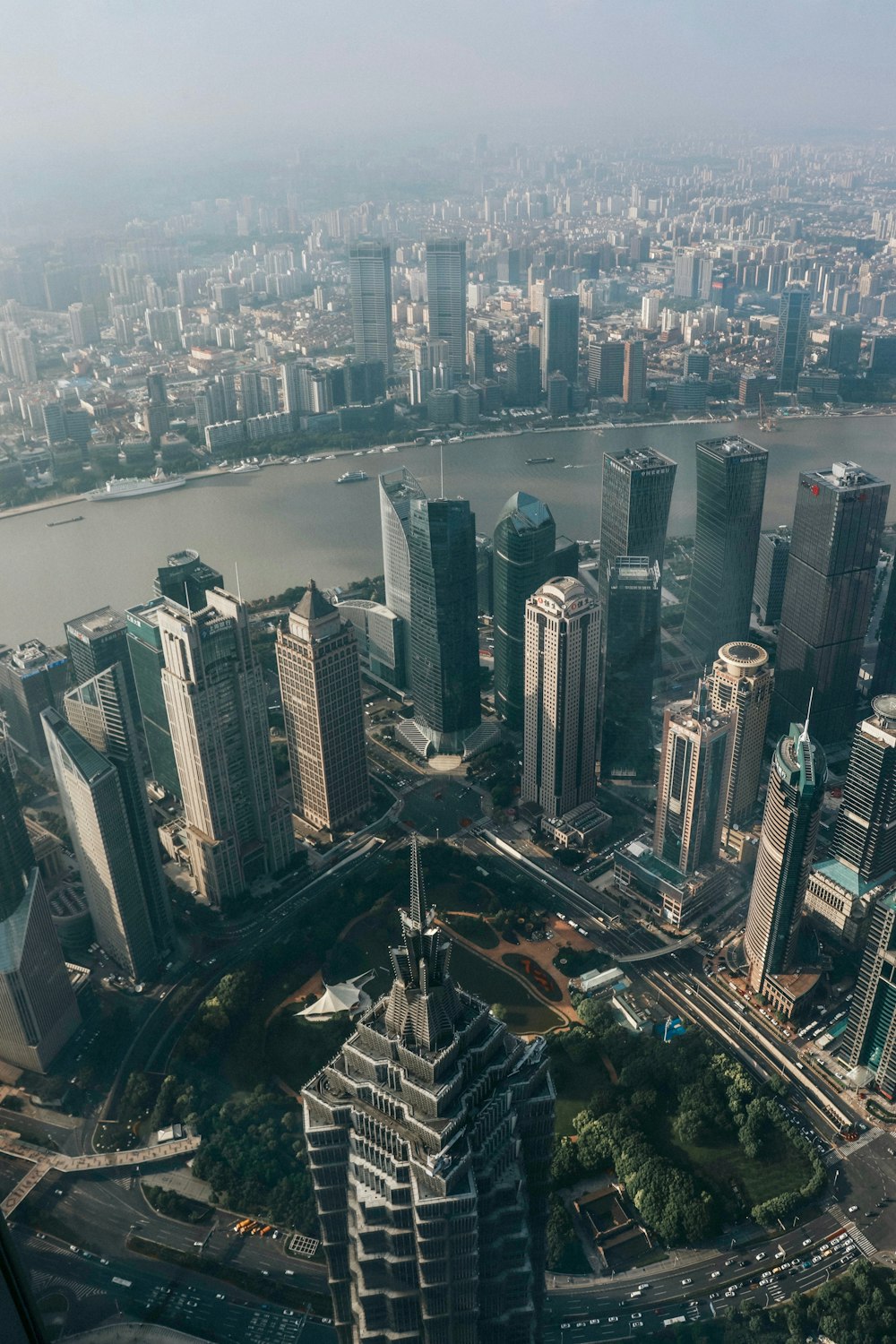 an aerial view of a city with tall buildings