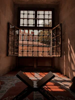 An open door revealing a peaceful room with soft cushions and natural light.