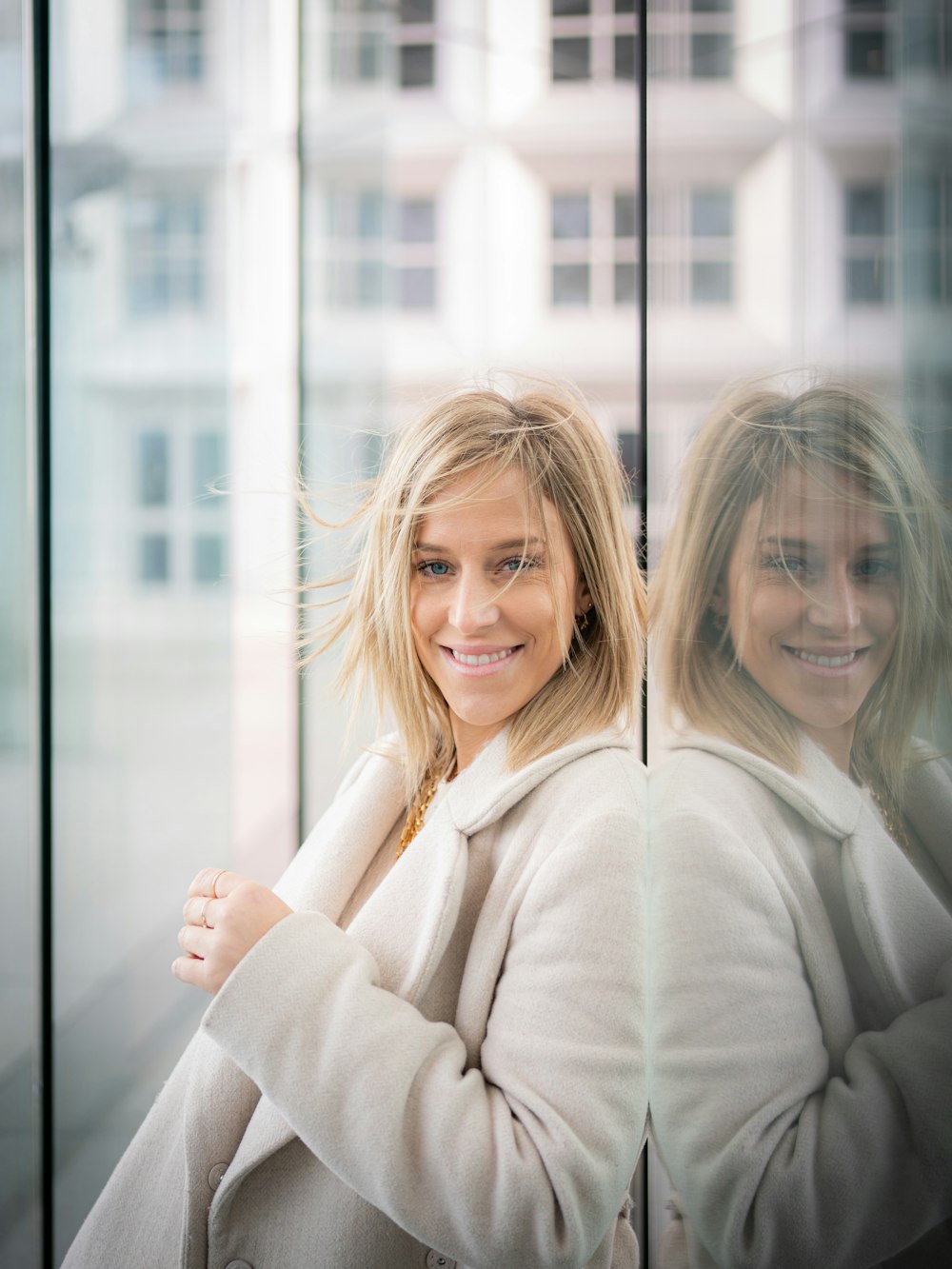 woman in white sweater smiling