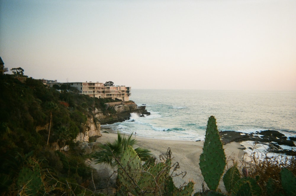 white concrete building near sea during daytime