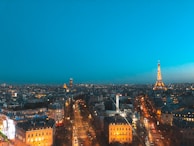 Evening cityscape of Paris with the Caerus Medical office building illuminated, symbolizing dedication.