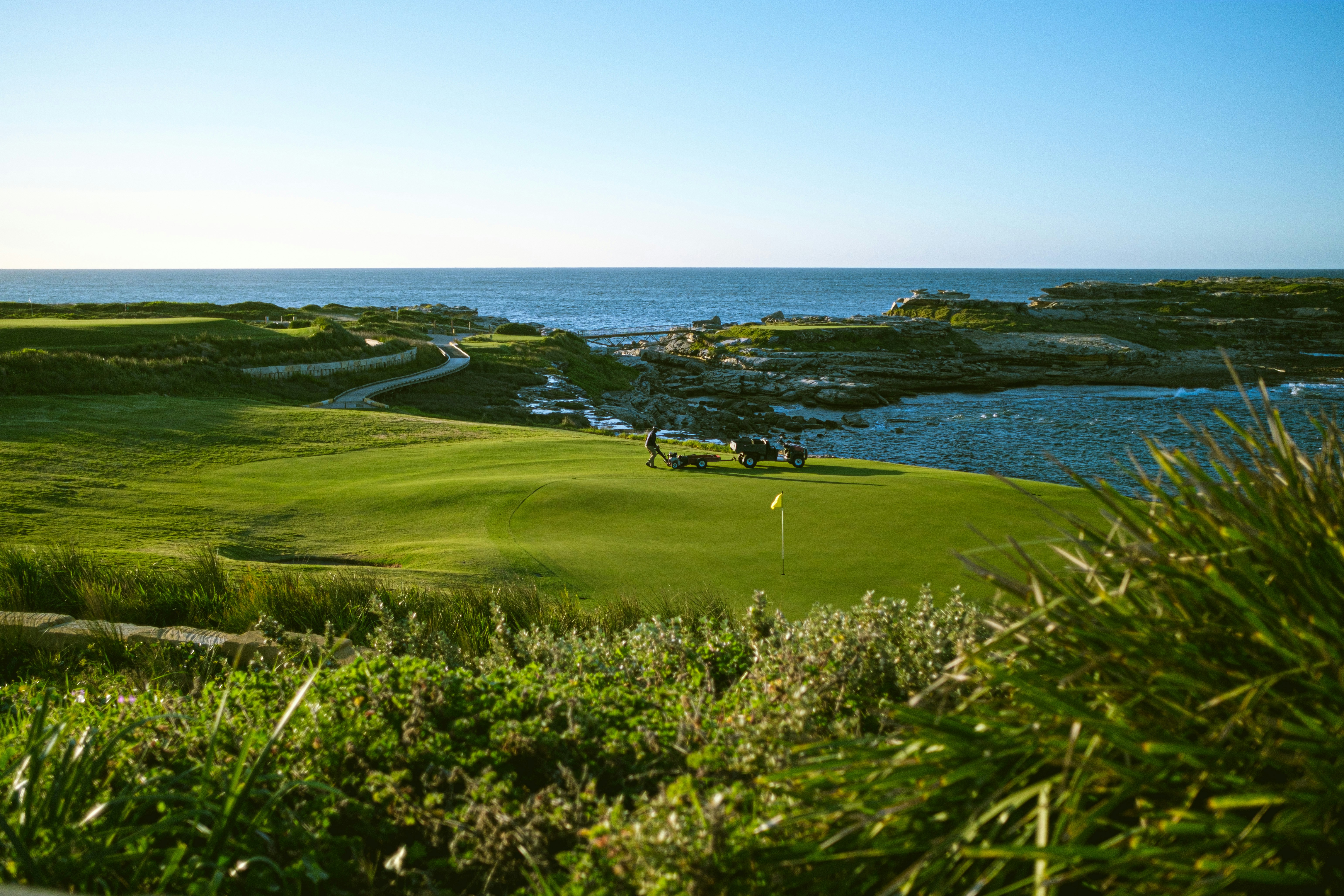 a view of a golf course near the ocean