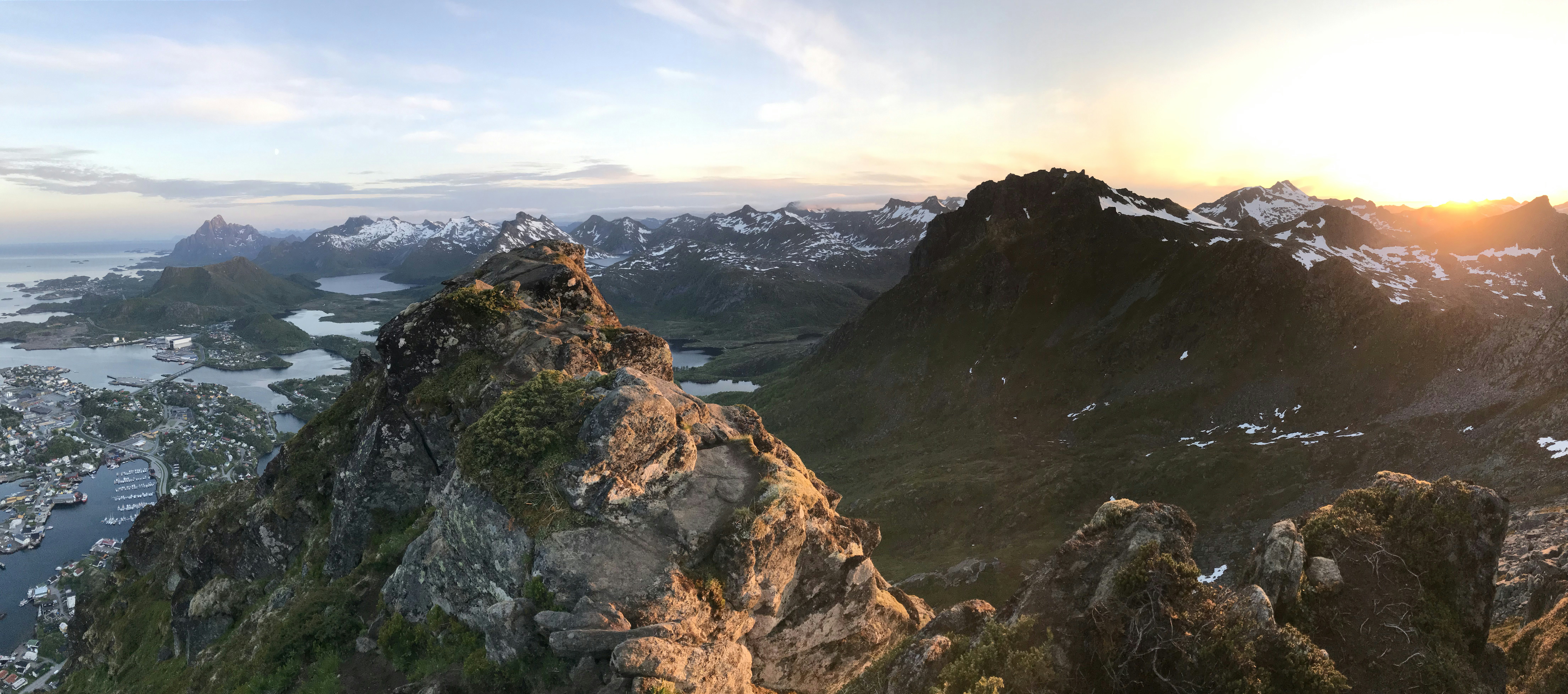 brown rocky mountain under white clouds during daytime, Svolvaer, Lofoten, Norway. Hiking to see the midnight sun!</p><p>No edit