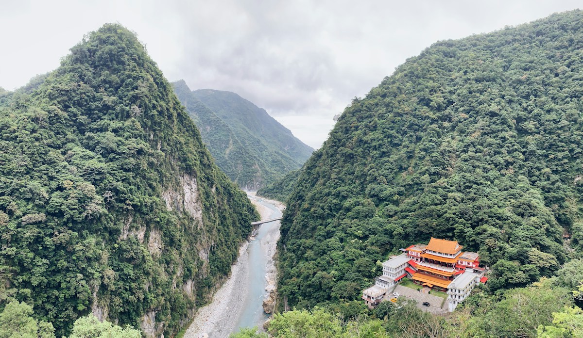 A temple complex on a forested slope above the Liwu River valley