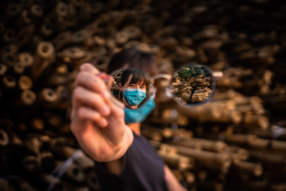 person holding clear glass ball