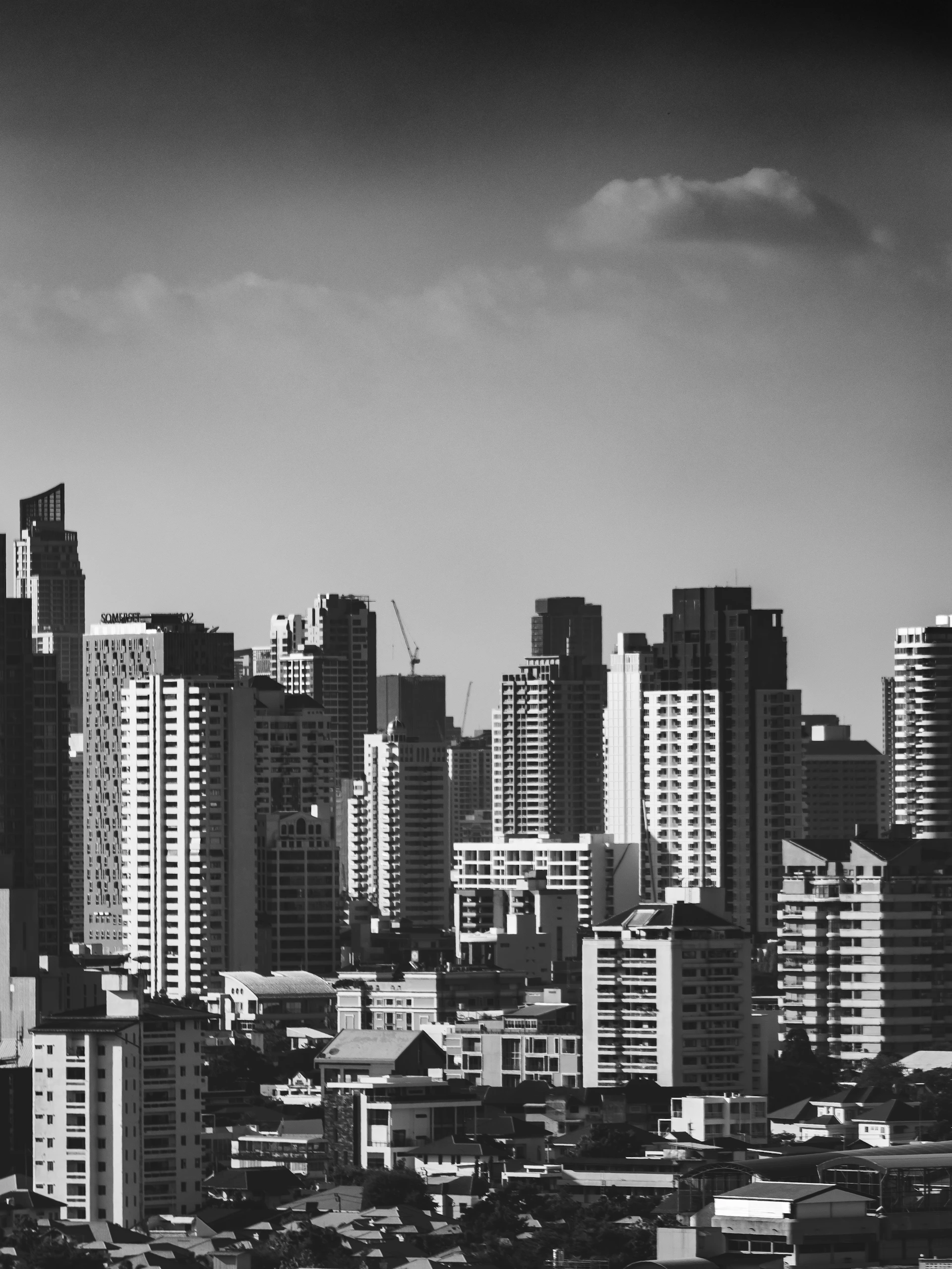 grayscale photo of city buildings