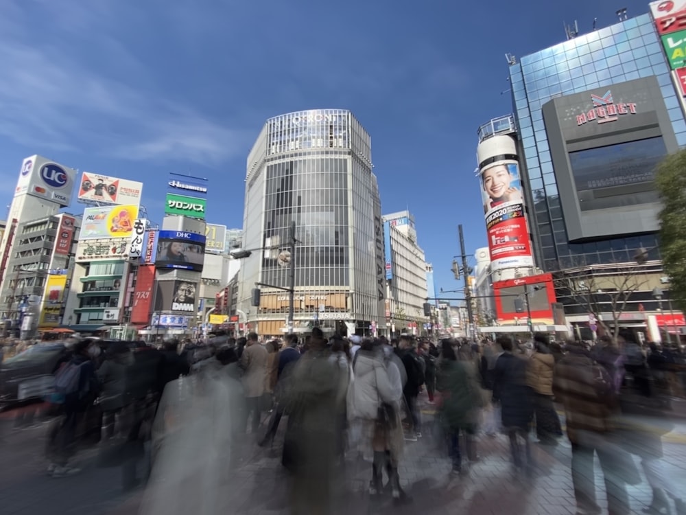 people walking on the street near buildings during daytime