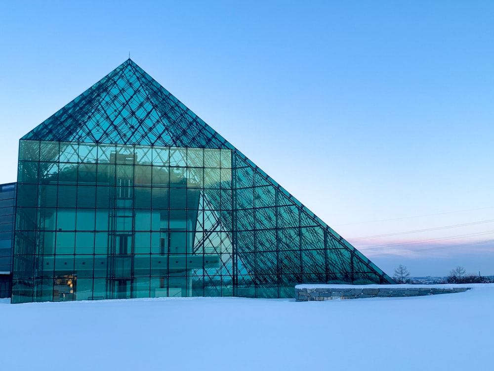 glass building near body of water during daytime