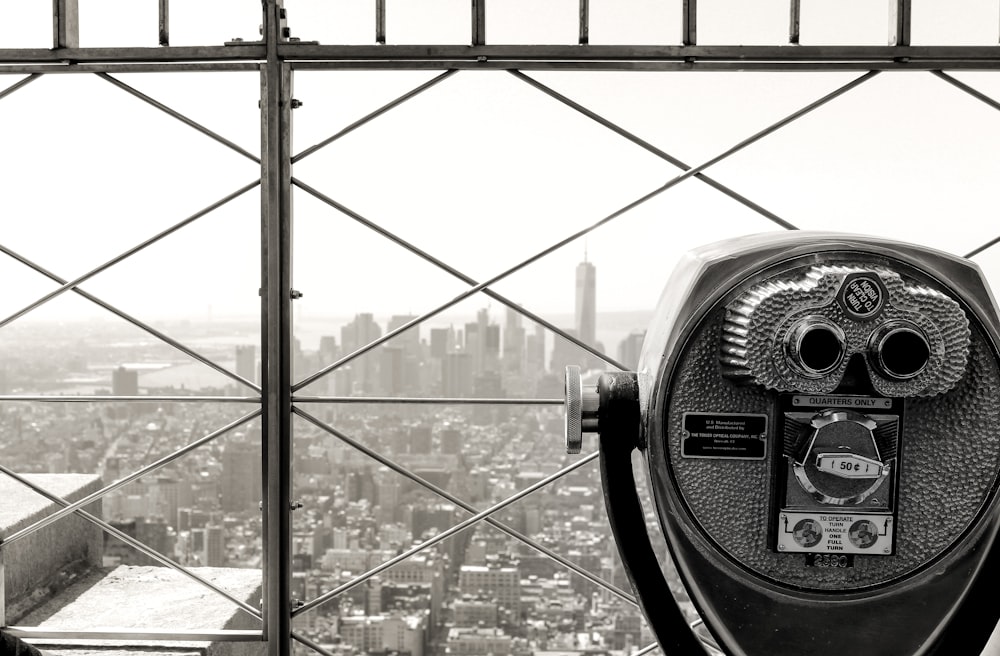 black and silver coin operated telescope