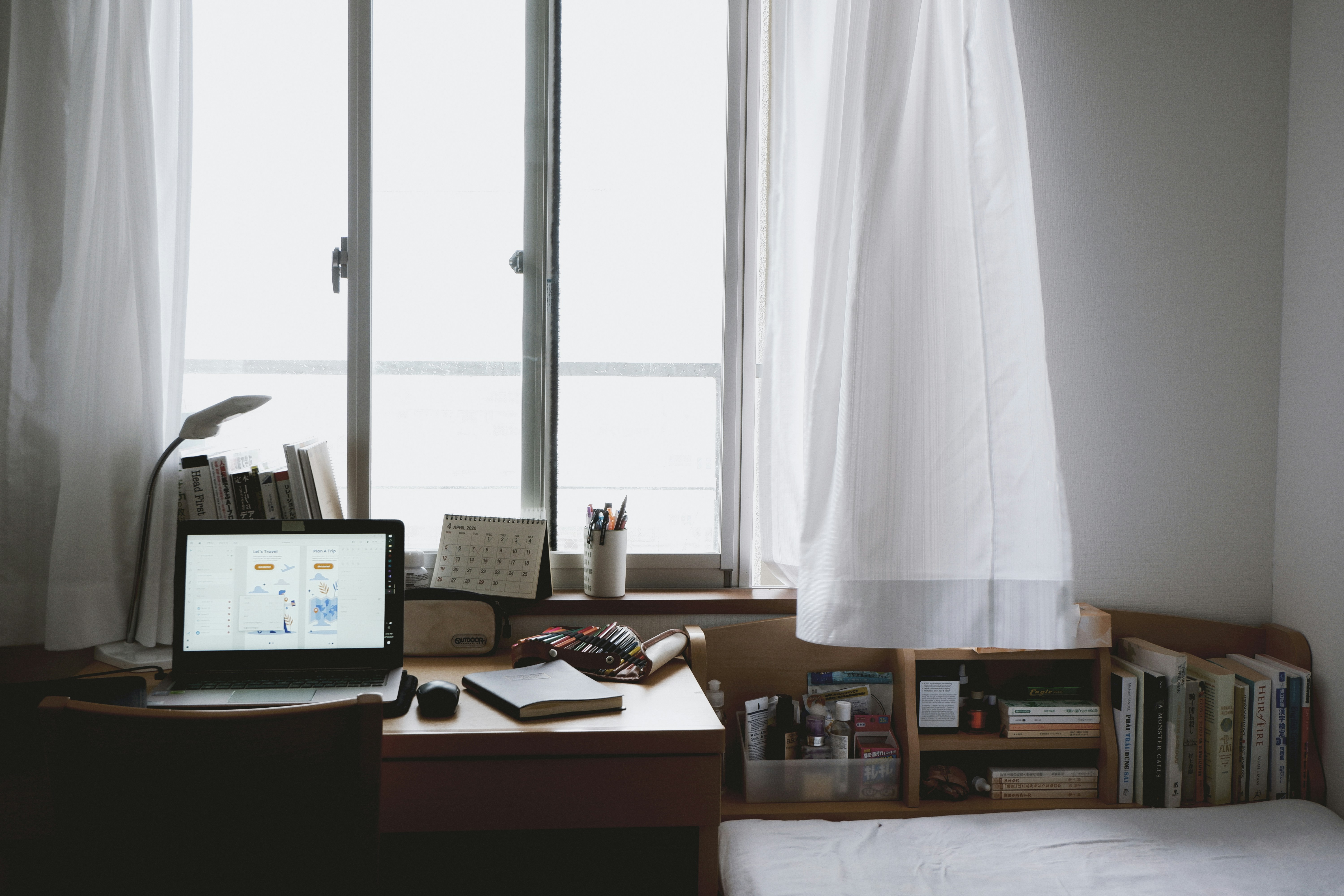 black flat screen computer monitor on brown wooden desk