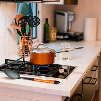 stainless steel cooking pot on white gas stove