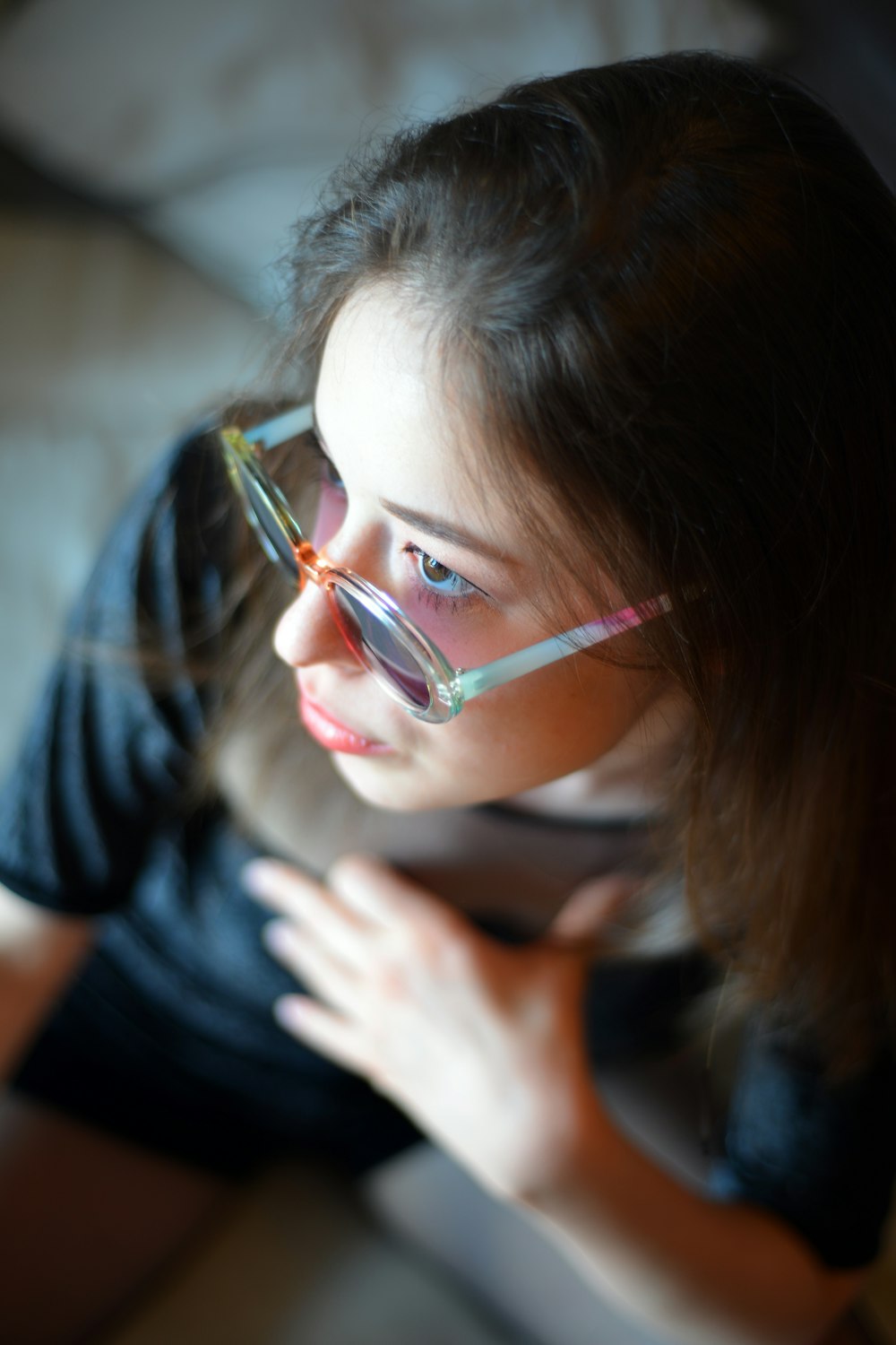 girl in black crew neck t-shirt wearing eyeglasses