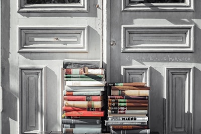 books on gray wooden door