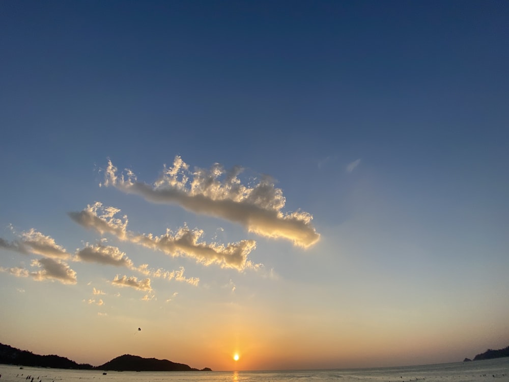 silhouette of mountain under blue sky during sunset