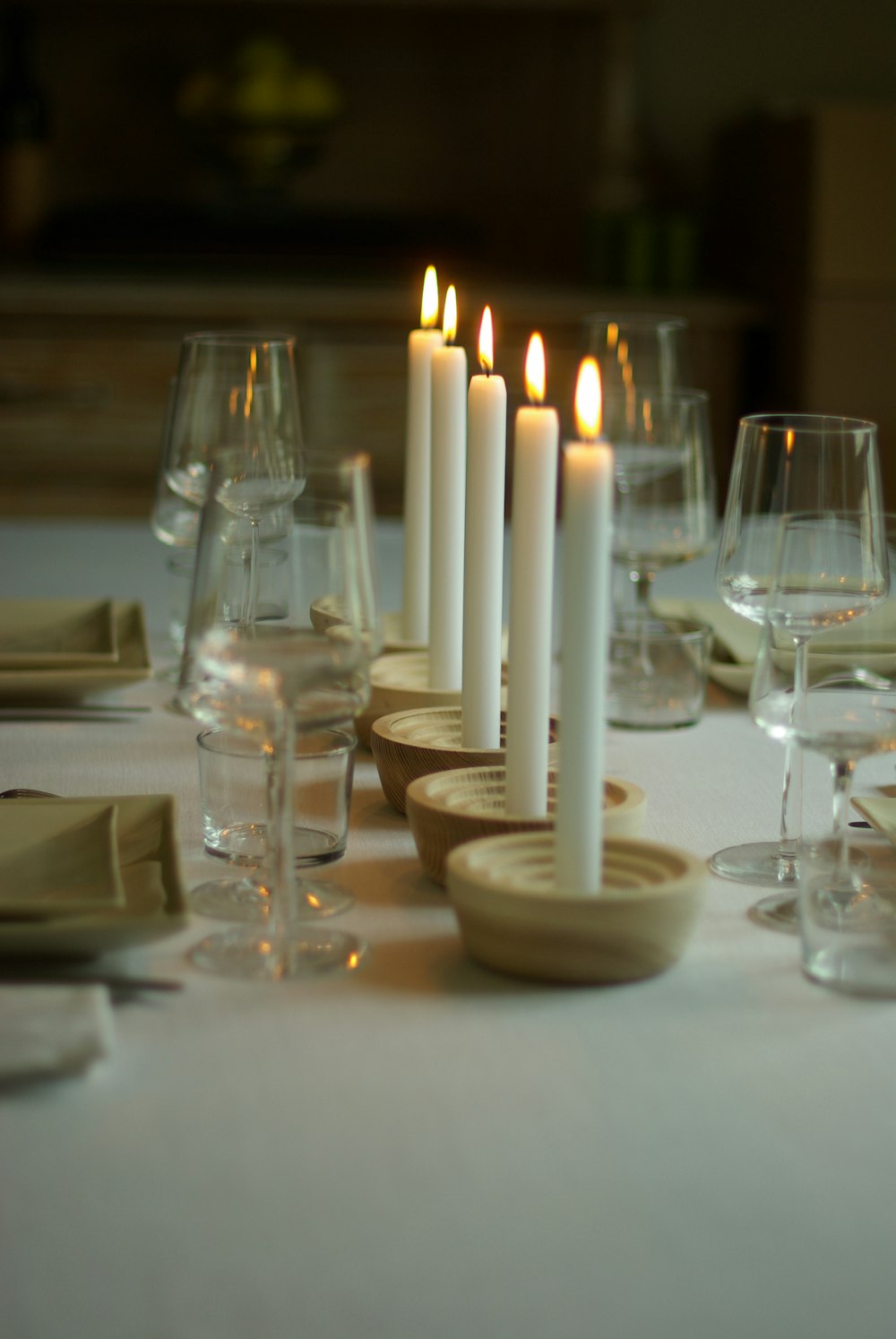 white candles on white table cloth