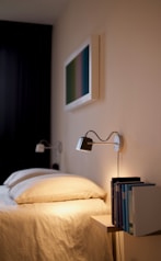black and silver desk lamp on brown wooden table