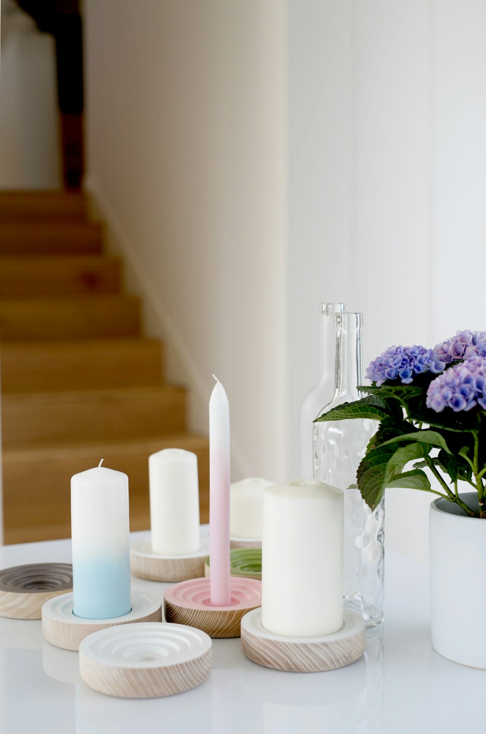 white pillar candles on clear glass candle holder