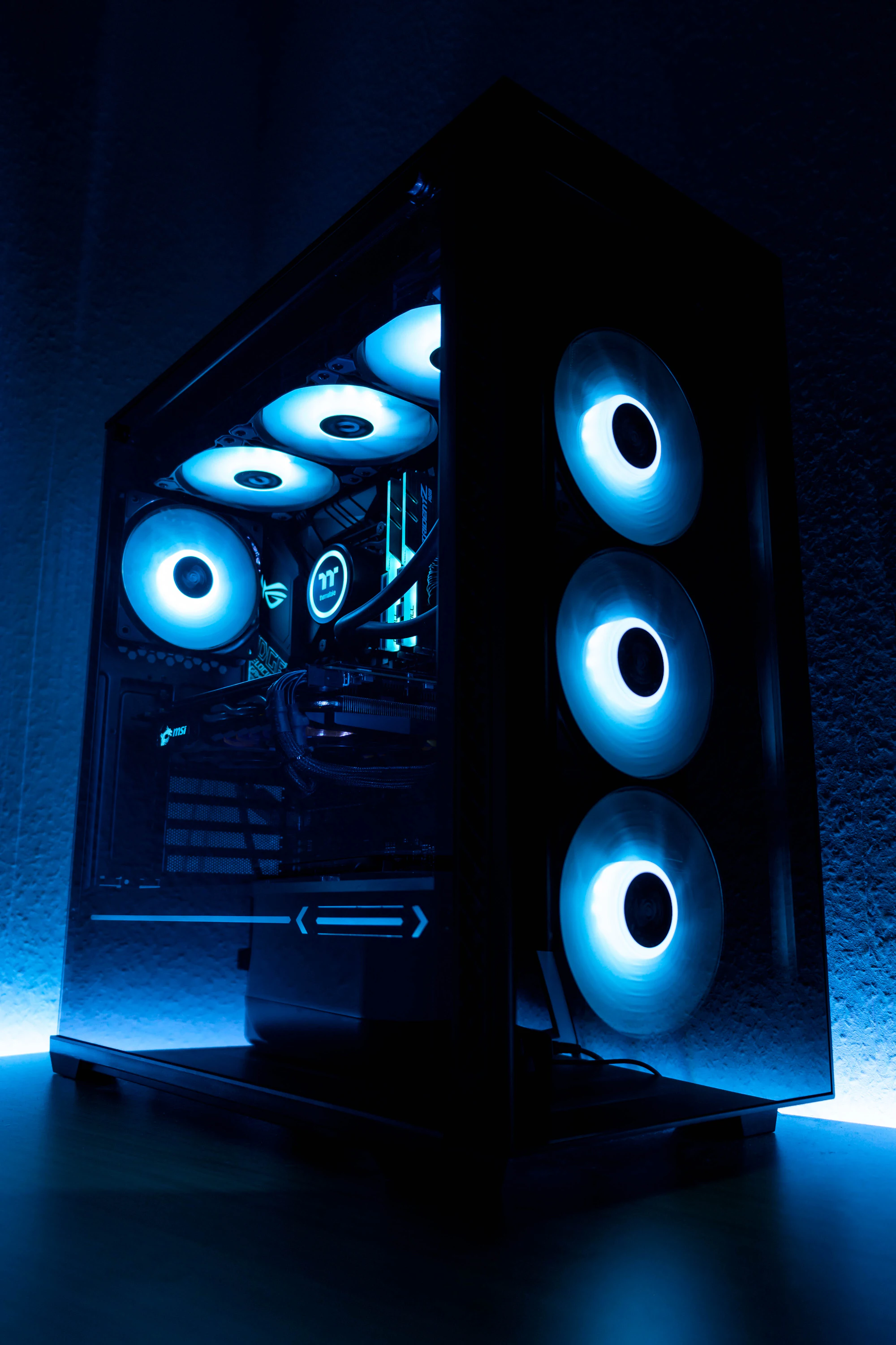 Illuminated blue cooling fans inside a custom-built PC