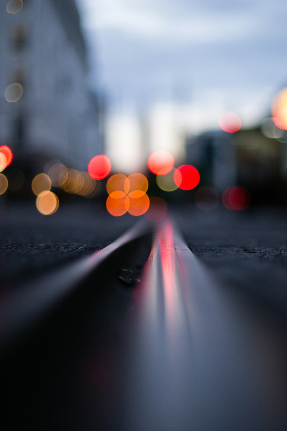 black asphalt road with white and pink lights