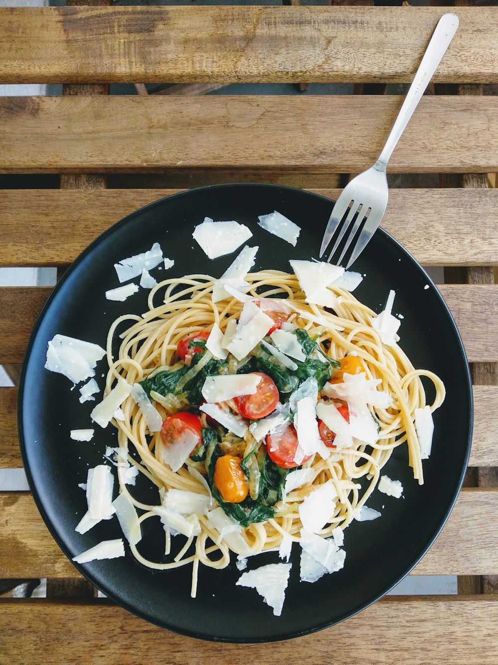 pasta dish on black ceramic plate