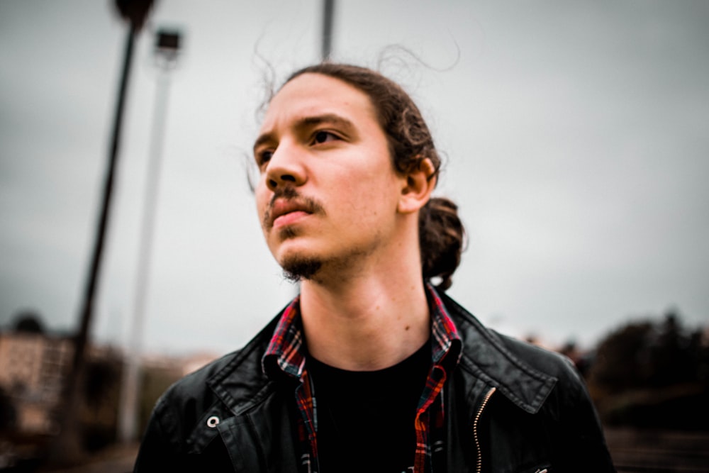 man in black leather jacket