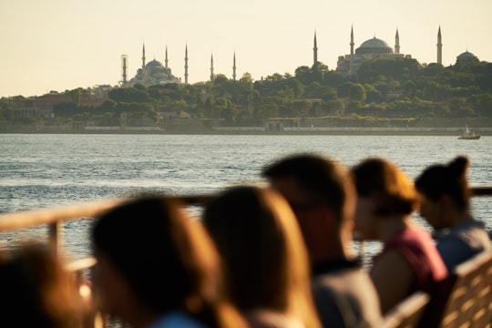people standing on seashore during daytime in Istanbul Turkey