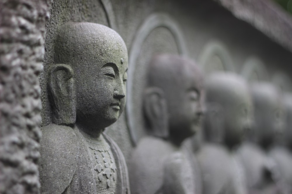 gray concrete statues during daytime