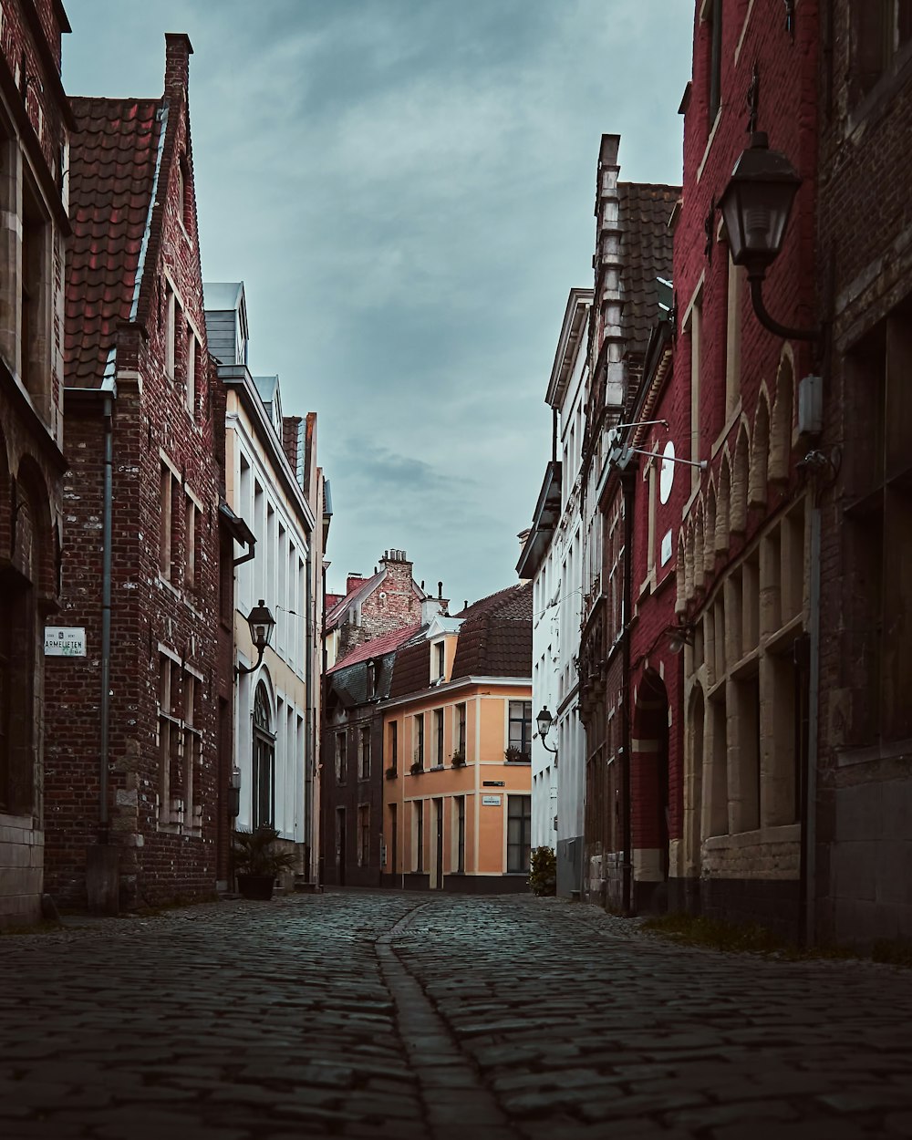 red brick building under cloudy sky during daytime