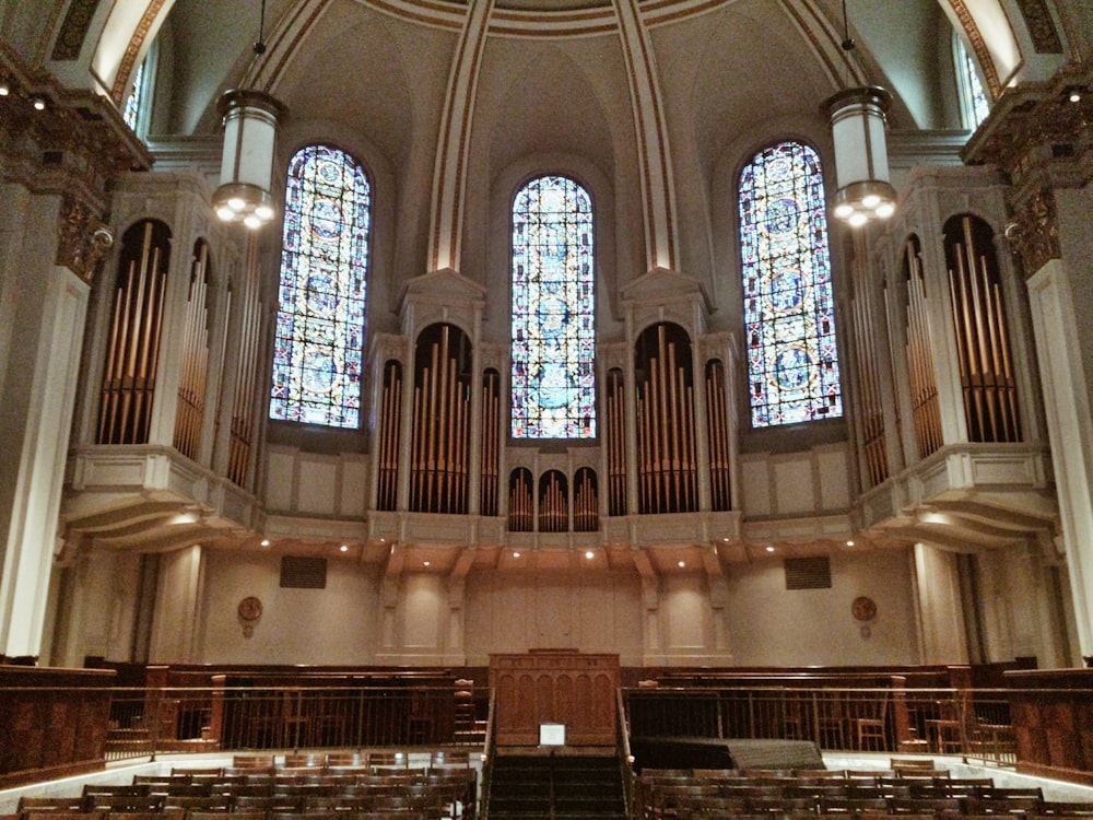 brown wooden bench inside cathedral