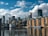 city skyline across body of water during daytime