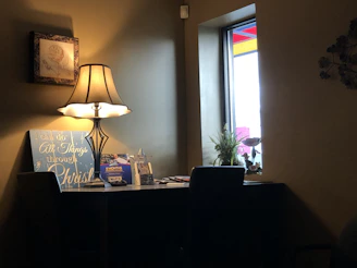 A cozy home interior with a glowing lamp symbolizing electricity usage