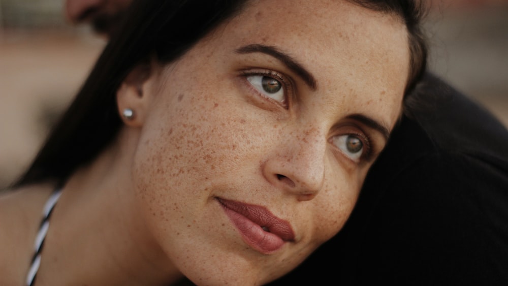 woman with red lipstick and black mascara