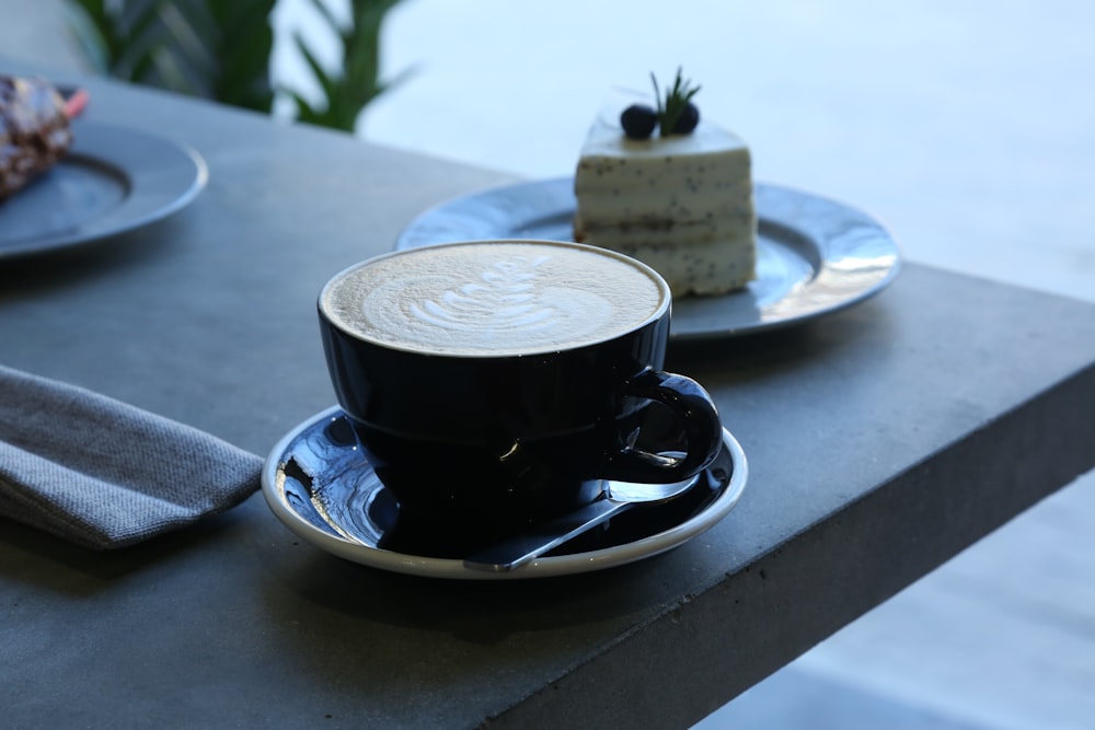 black ceramic cup on saucer