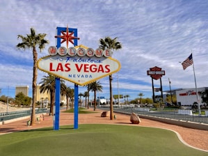 A group of tourists enjoying a guided tour in front of a famous Las Vegas landmark.