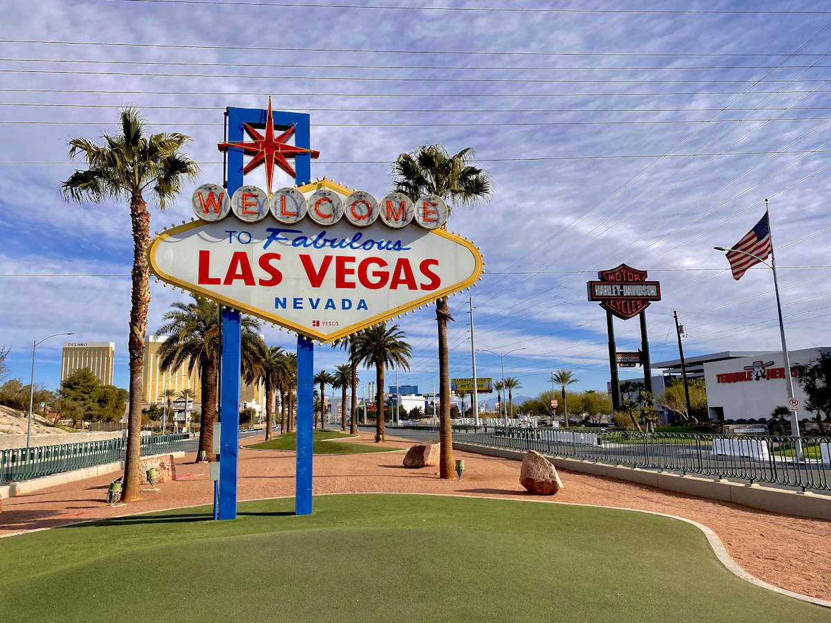 The Welcome to Fabulous Las Vegas sign under a bright desert sky