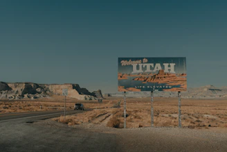 a large sign on the side of a road