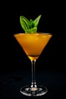 orange liquid in clear cocktail glass