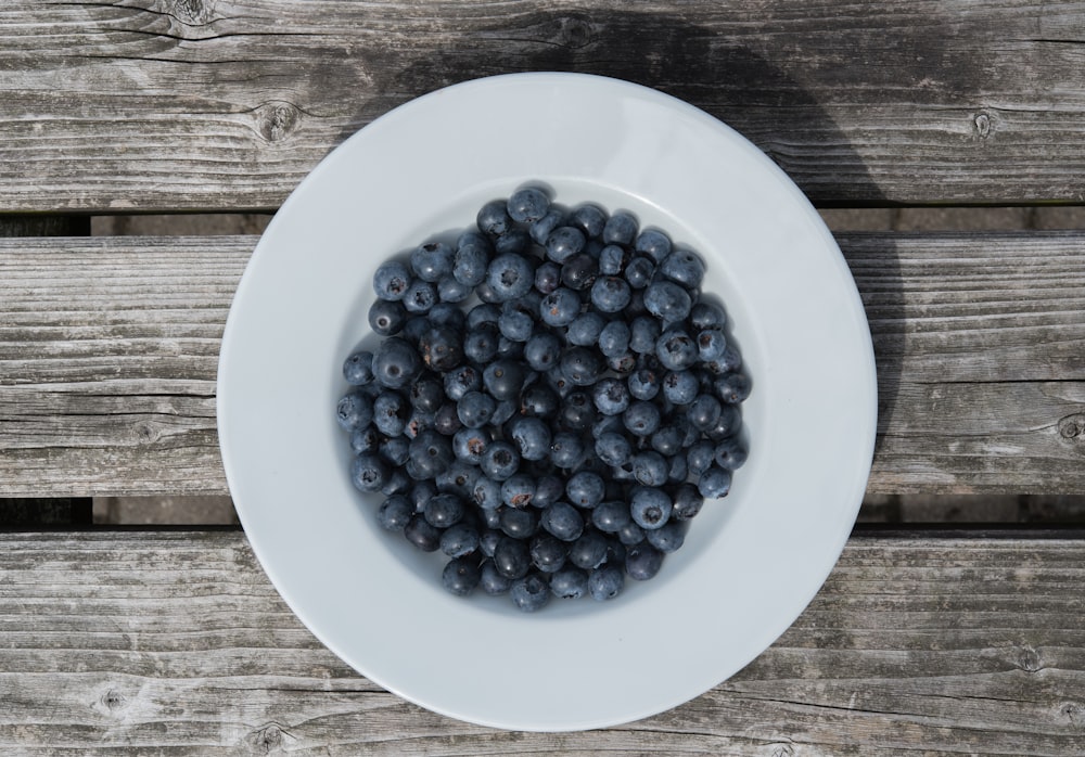 blue berries on white ceramic plate